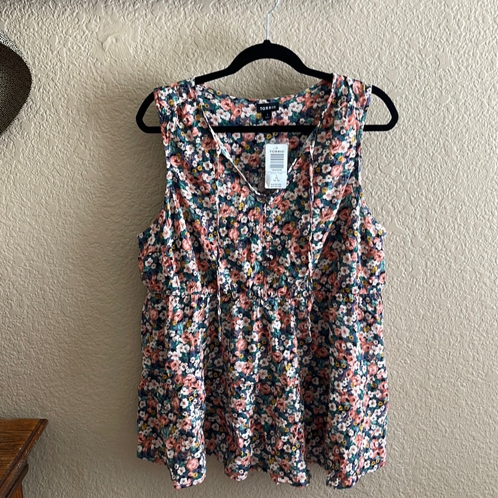 Torrid, floral sleeveless blouse.
